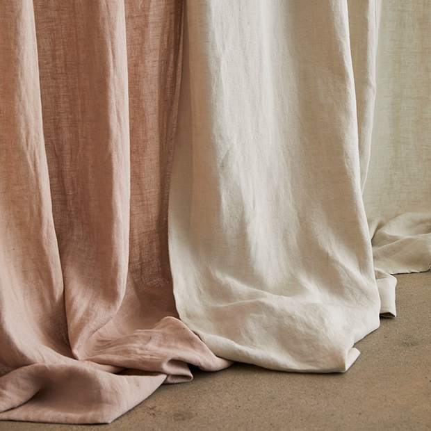 Soft pink and ivory linen fabrics showing their weave and drape